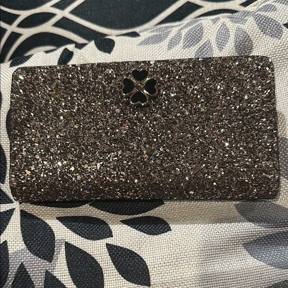Kate Spade medium slim “Odette” glitter wallet. New without tags